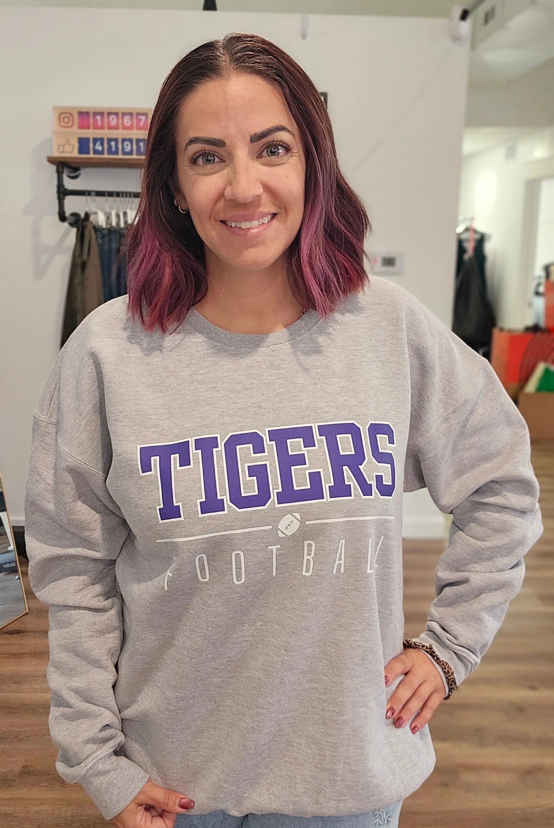 Shop Varsity Football Mascot Sweatshirt- at Ruby Joy Boutique, a Women's Clothing Store in Pickerington, Ohio
