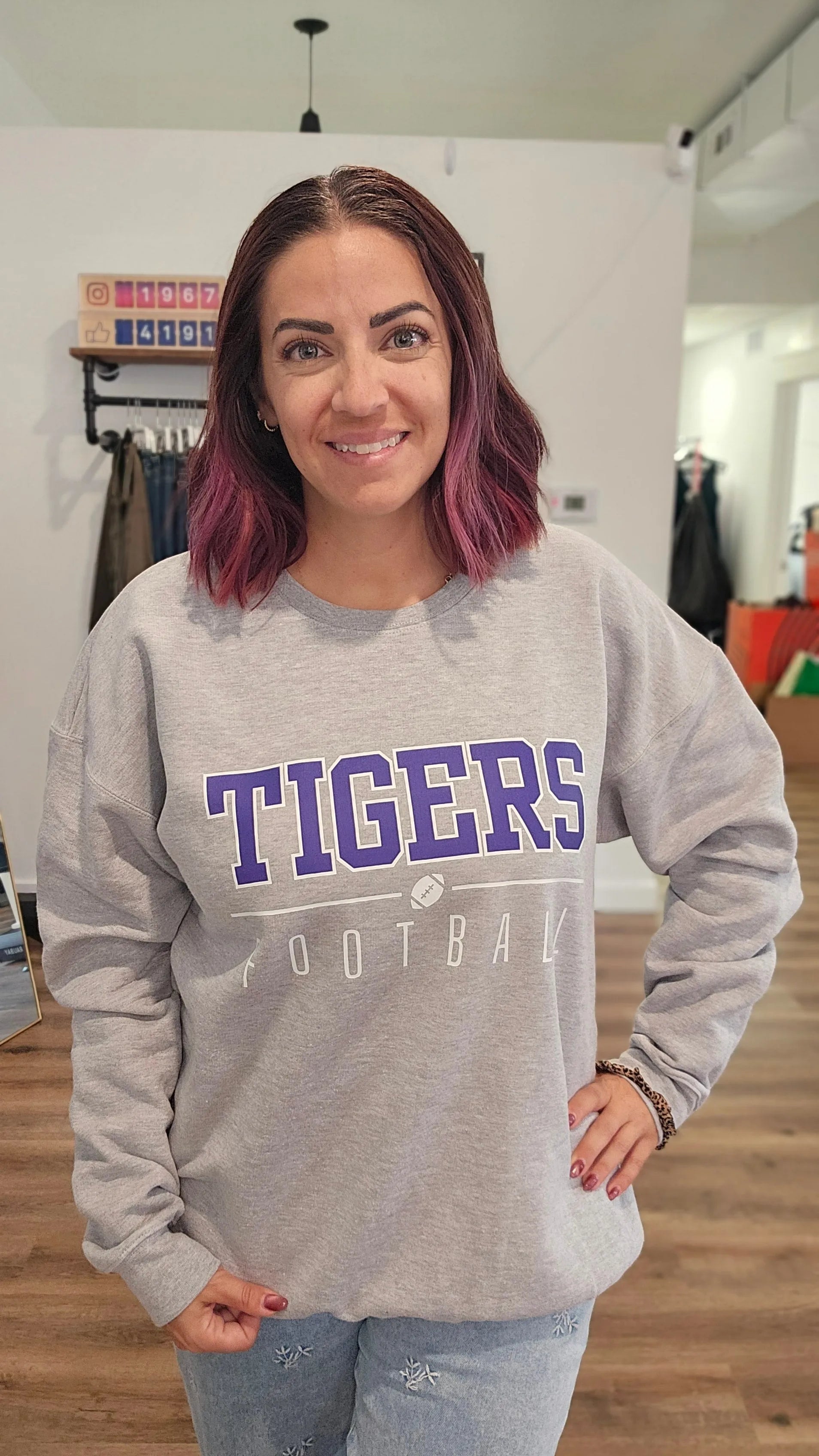 Shop Varsity Football Mascot Sweatshirt- at Ruby Joy Boutique, a Women's Clothing Store in Pickerington, Ohio
