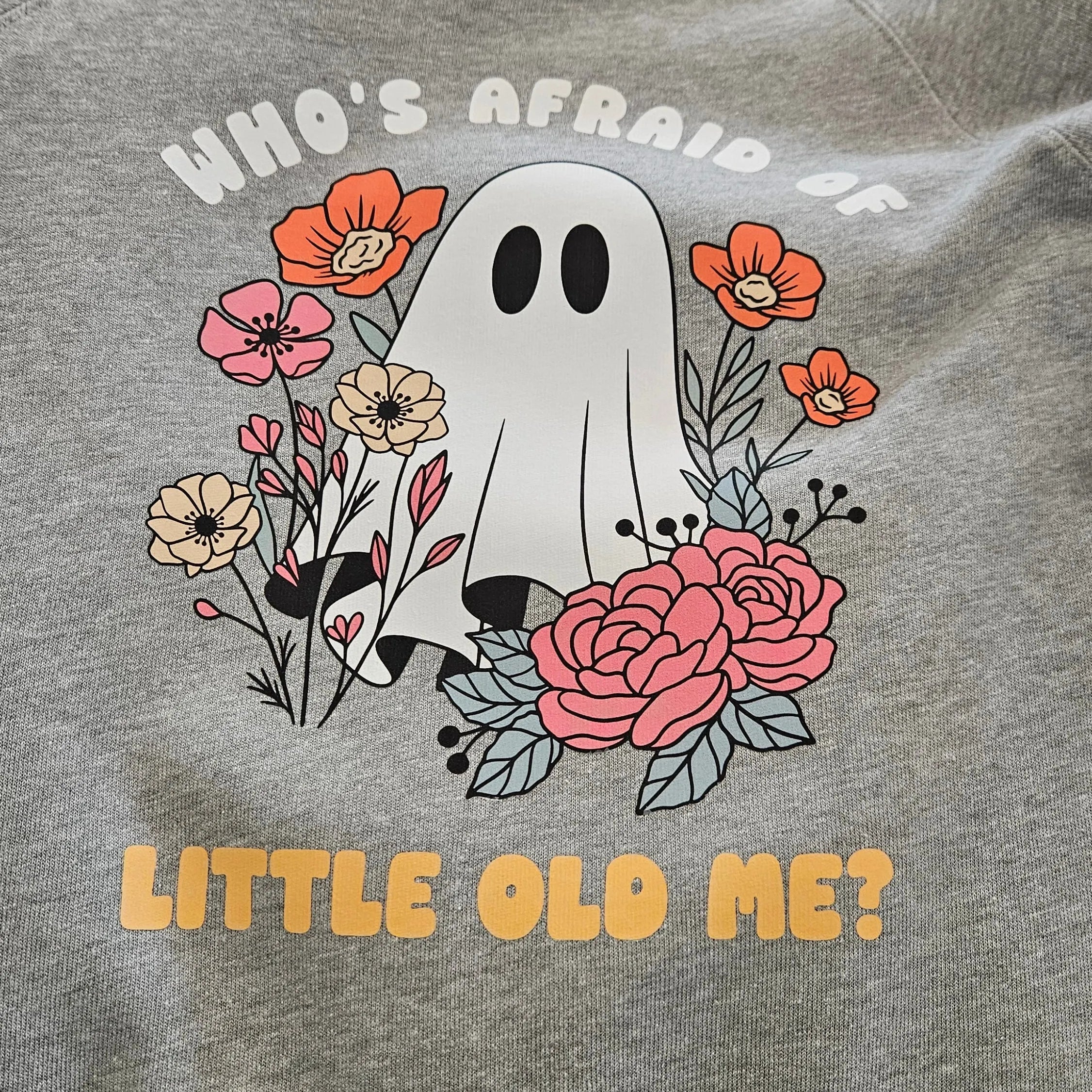 Shop Who's Afraid Of Little Old Me? Ghost Graphic-Small at Ruby Joy Boutique, a Women's Clothing Store in Pickerington, Ohio