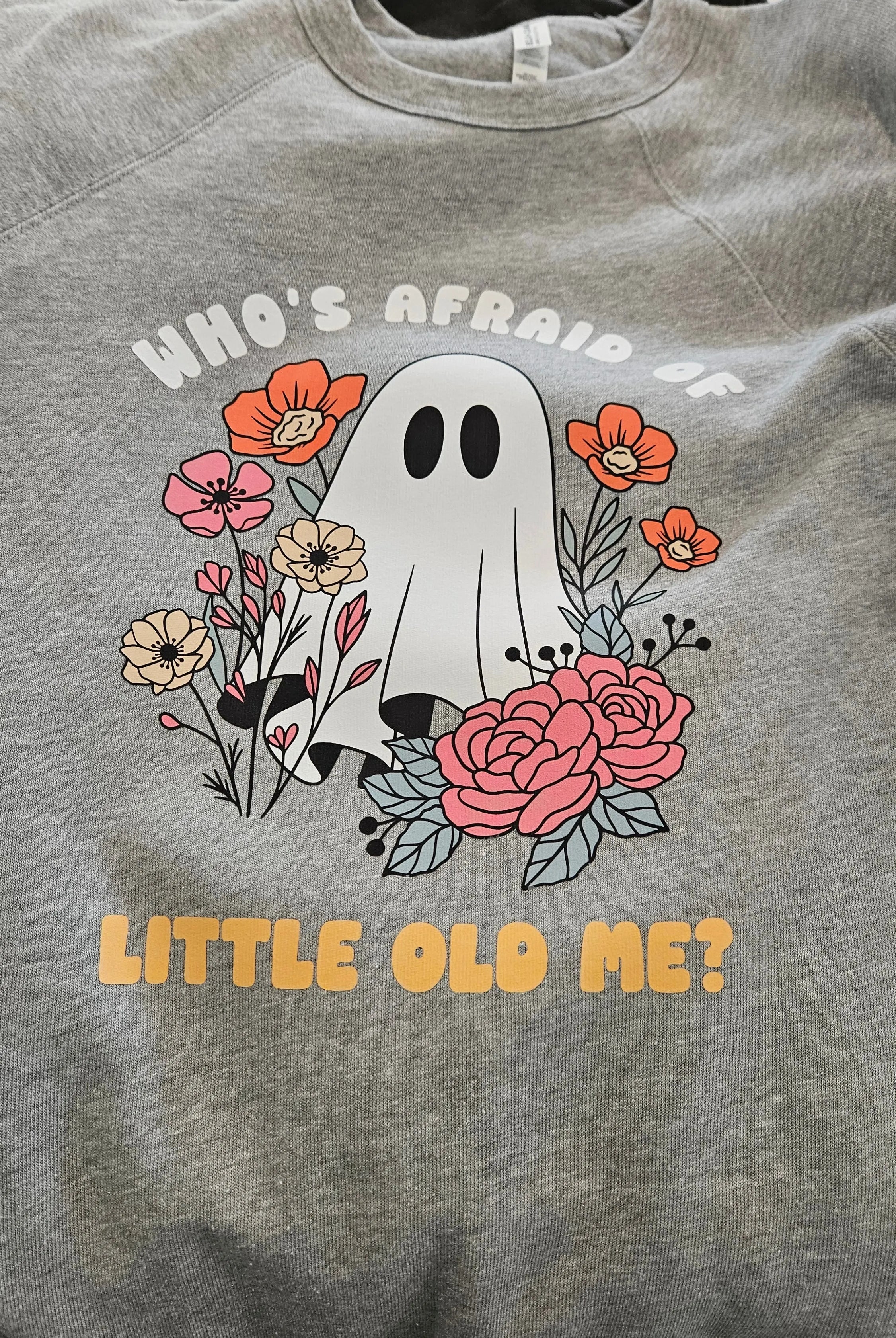 Shop Who's Afraid Of Little Old Me? Ghost Graphic-Small at Ruby Joy Boutique, a Women's Clothing Store in Pickerington, Ohio