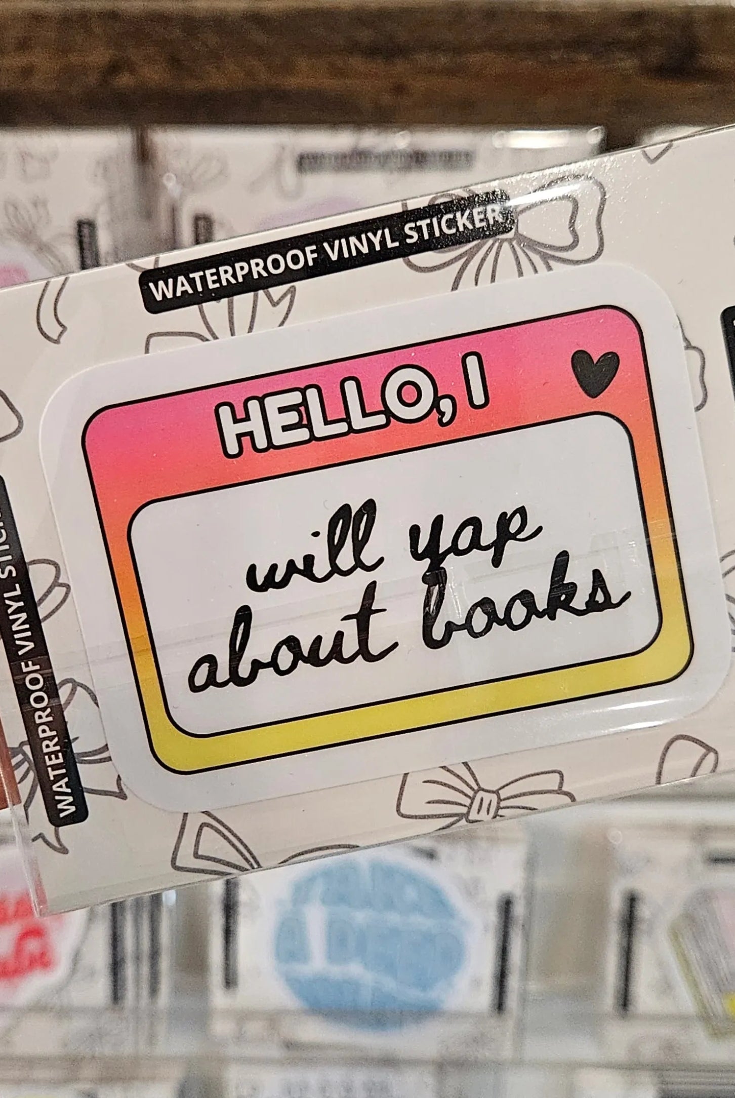 Shop Will Yap About Books Name Tag | Waterproof Vinyl Sticker- at Ruby Joy Boutique, a Women's Clothing Store in Pickerington, Ohio
