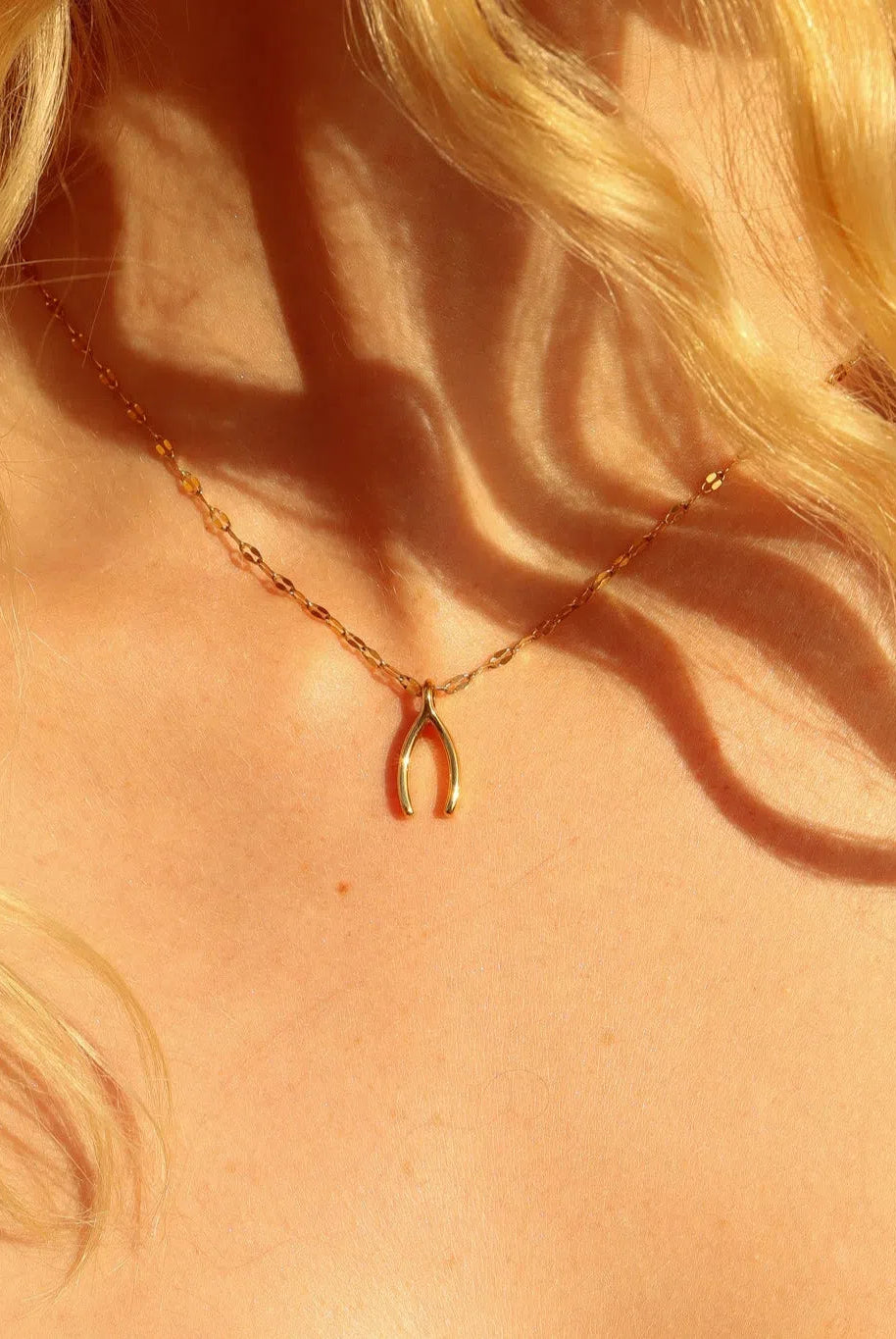 Shop Wishbone Charm- at Ruby Joy Boutique, a Women's Clothing Store in Pickerington, Ohio