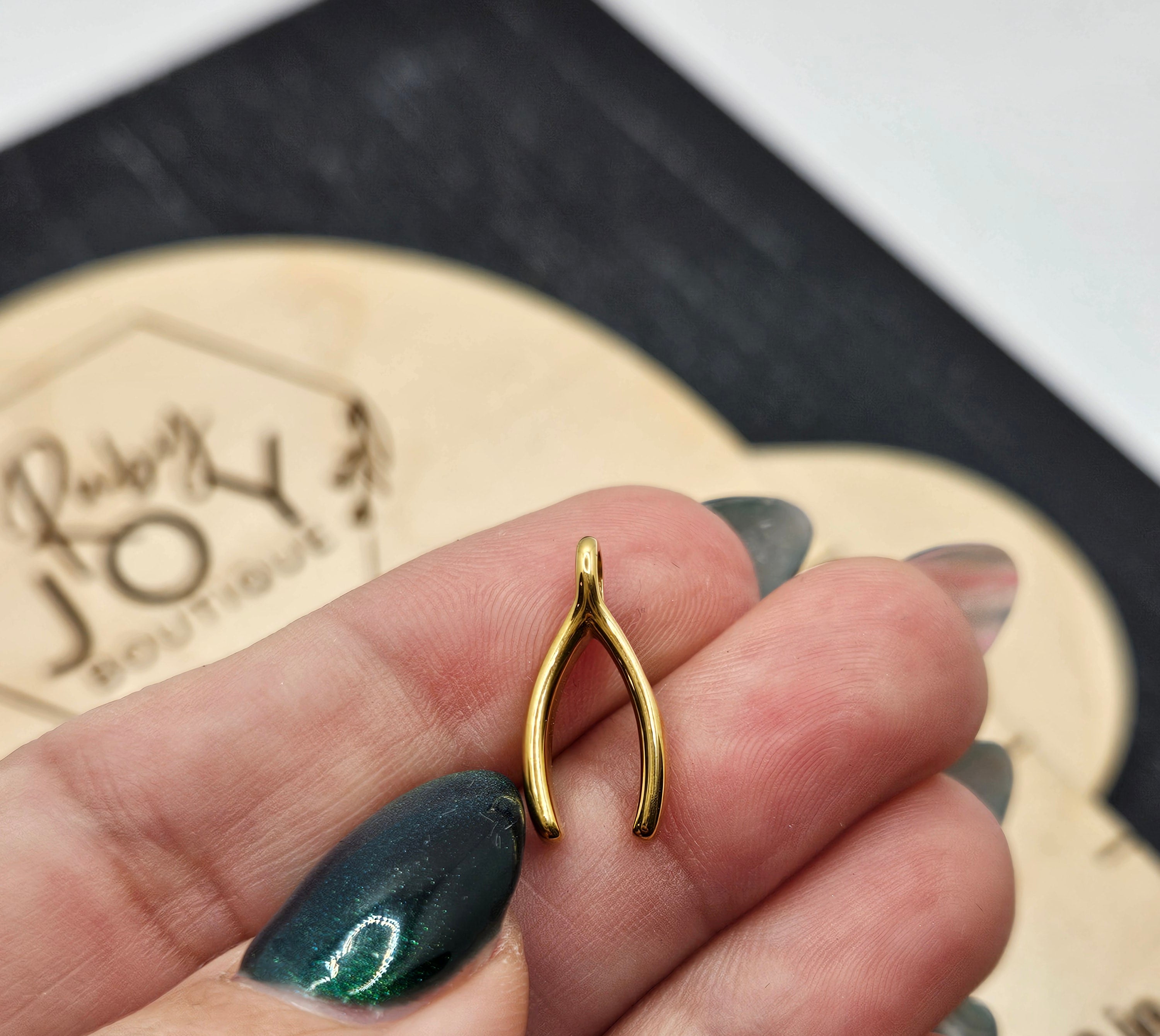 Shop Wishbone Charm- at Ruby Joy Boutique, a Women's Clothing Store in Pickerington, Ohio