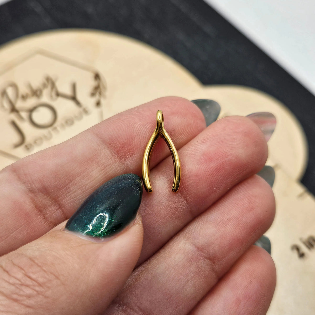 Shop Wishbone Charm- at Ruby Joy Boutique, a Women's Clothing Store in Pickerington, Ohio