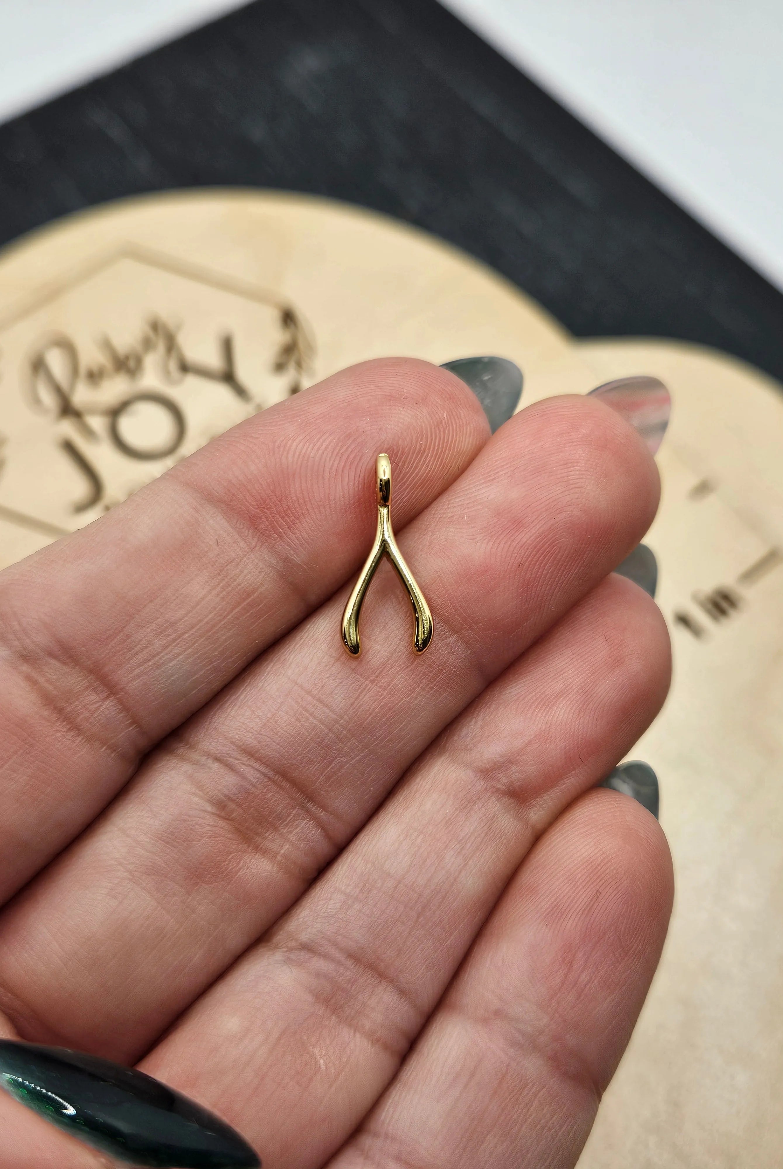 Shop Wishbone Charm- at Ruby Joy Boutique, a Women's Clothing Store in Pickerington, Ohio