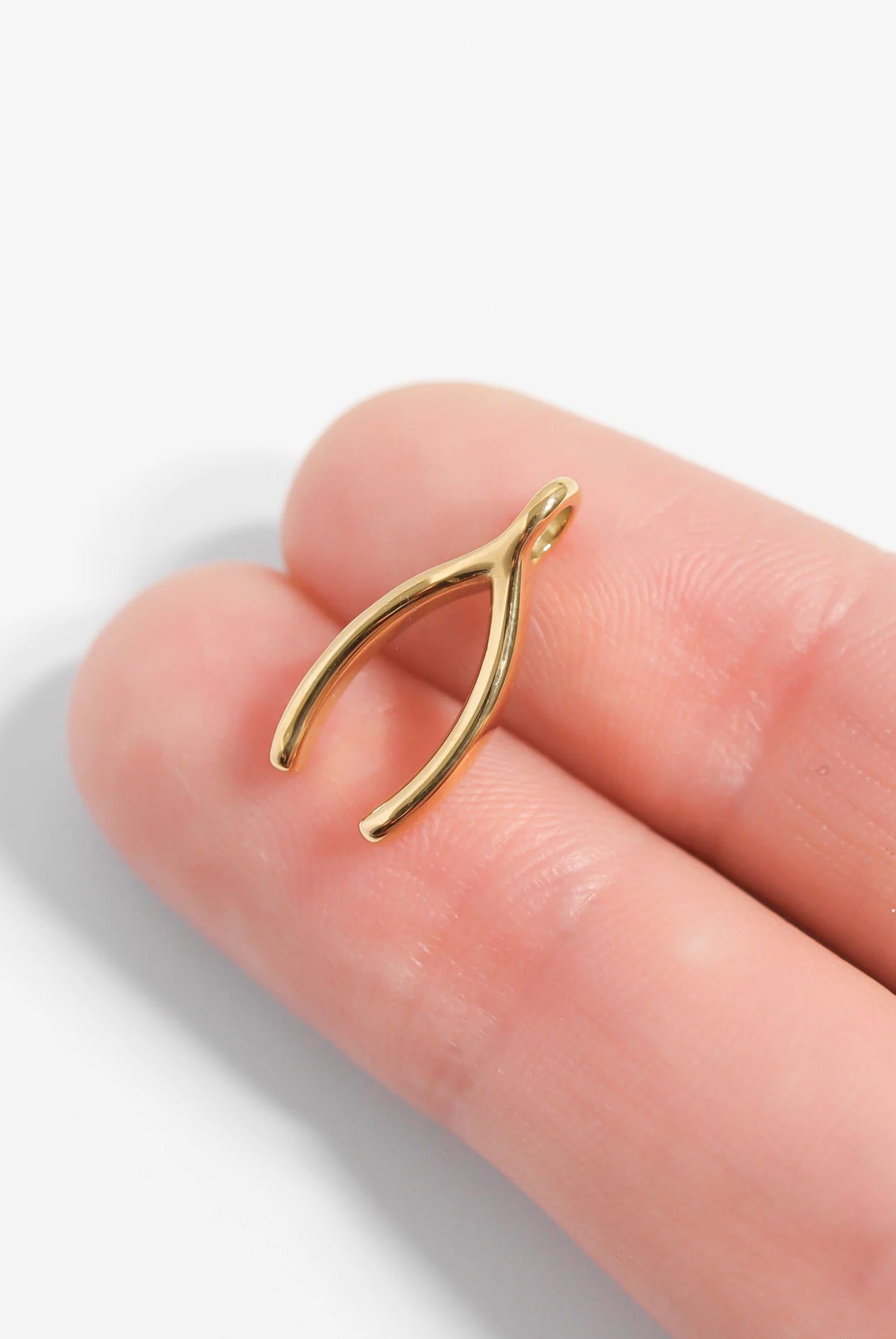 Shop Wishbone Charm- at Ruby Joy Boutique, a Women's Clothing Store in Pickerington, Ohio