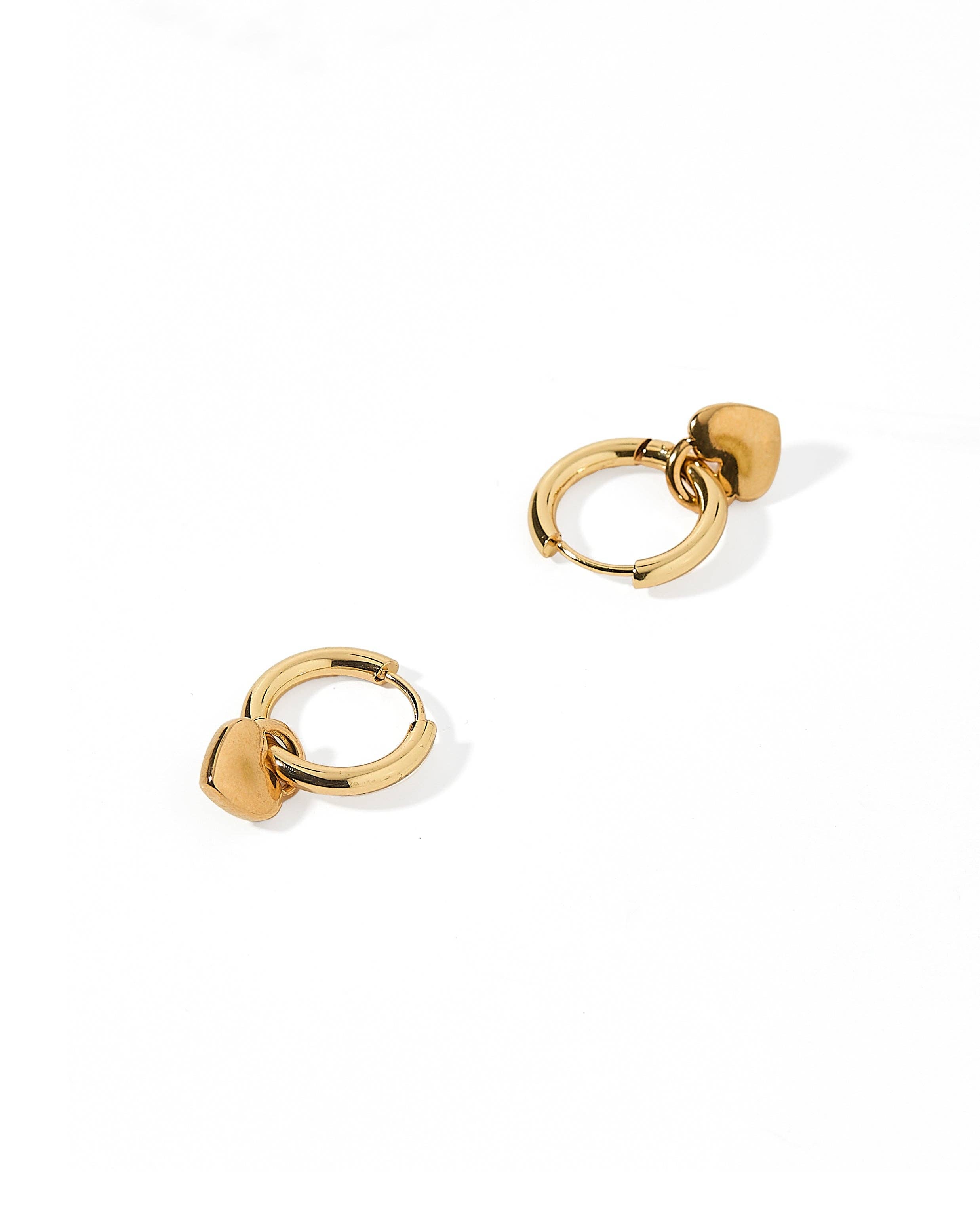 Shop Dakota Heart Huggie Charm Earrings- at Ruby Joy Boutique, a Women's Clothing Store in Pickerington, Ohio