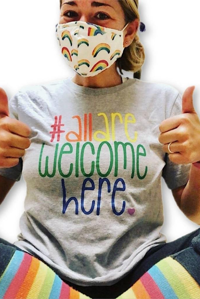 Shop All Are Welcome Here Classic Tee- at Ruby Joy Boutique, a Women's Clothing Store in Pickerington, Ohio