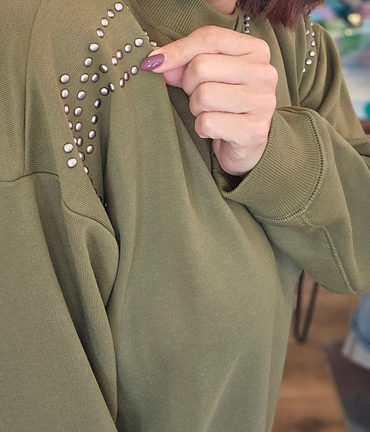 Shop Stud Shoulder Sweatshirt: Olive- at Ruby Joy Boutique, a Women's Clothing Store in Pickerington, Ohio