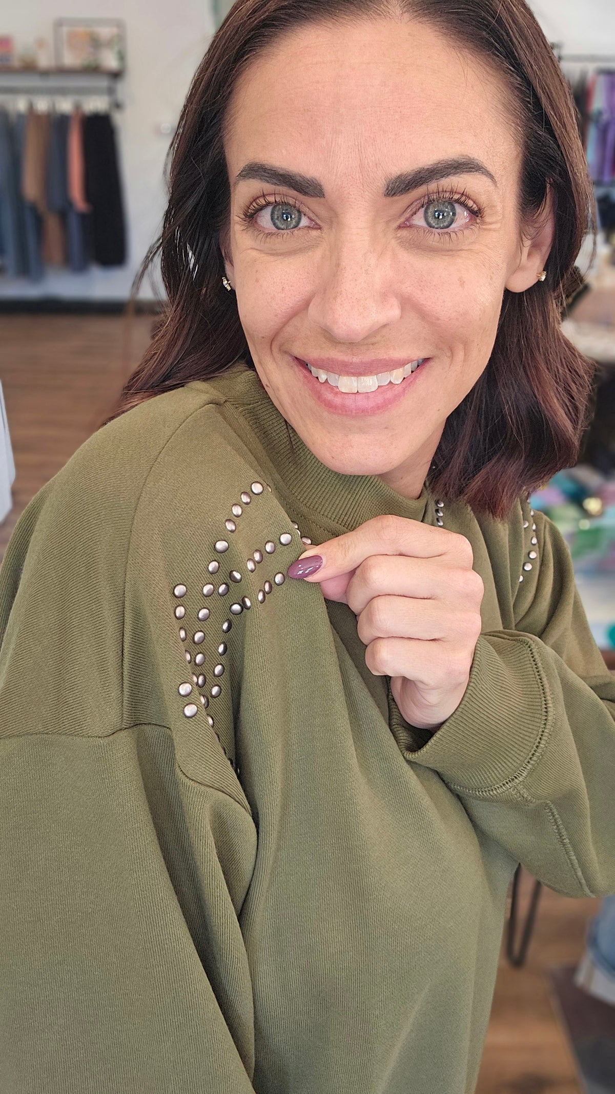Shop Stud Shoulder Sweatshirt: Olive- at Ruby Joy Boutique, a Women's Clothing Store in Pickerington, Ohio