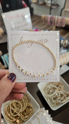 Shop 14K Gold-Filled Mantra Bracelet - White with Gold Letters-Bracelets at Ruby Joy Boutique, a Women's Clothing Store in Pickerington, Ohio
