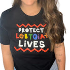 Shop Protect LGBTQIA+ Lives Classic Tee- at Ruby Joy Boutique, a Women's Clothing Store in Pickerington, Ohio
