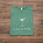 Shop A Tini Bit Lucky | St. Patrick's Day Graphic Top- at Ruby Joy Boutique, a Women's Clothing Store in Pickerington, Ohio