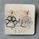 Shop Acrylic Paw Earrings-Silver at Ruby Joy Boutique, a Women's Clothing Store in Pickerington, Ohio