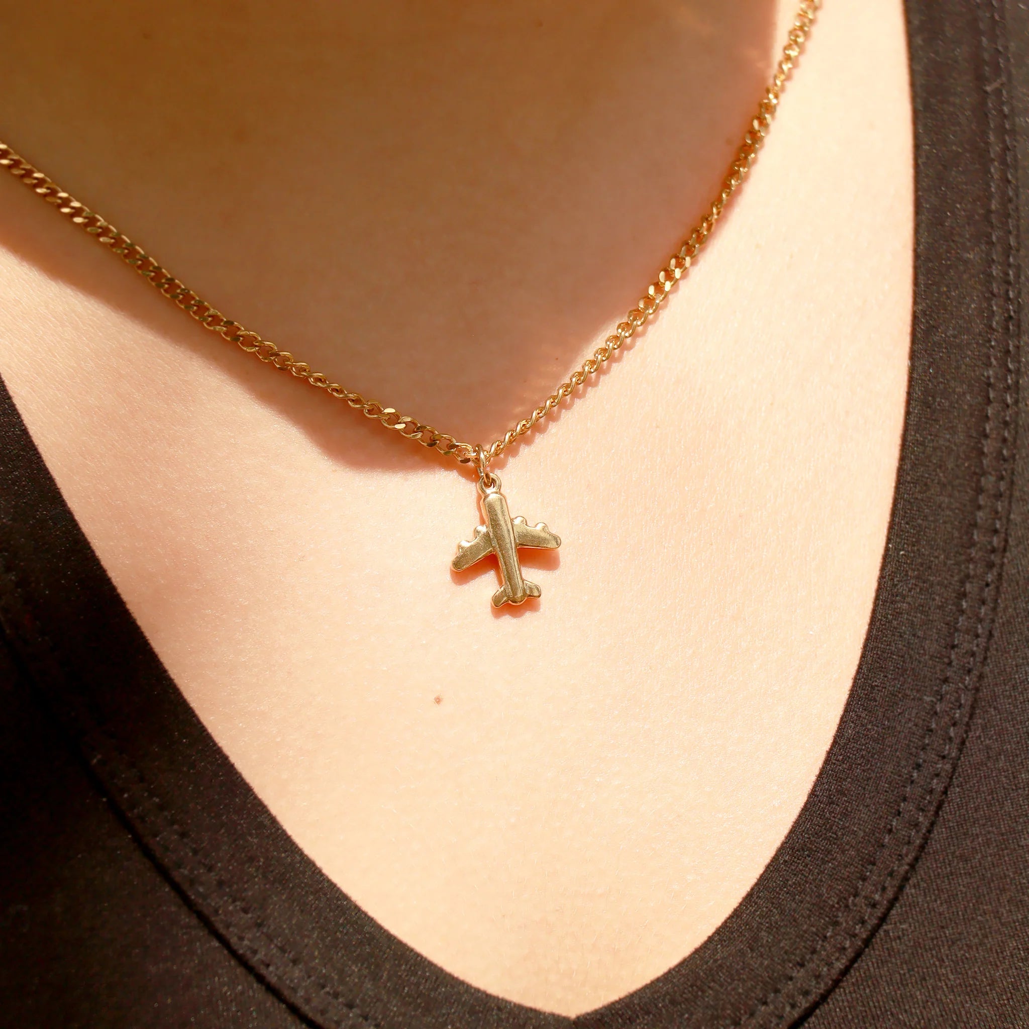 Shop Airplane Charm- at Ruby Joy Boutique, a Women's Clothing Store in Pickerington, Ohio