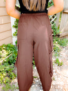 Shop Archer Asymmetrical Pocket Wide Leg Cargos-Rose Brown at Ruby Joy Boutique, a Women's Clothing Store in Pickerington, Ohio