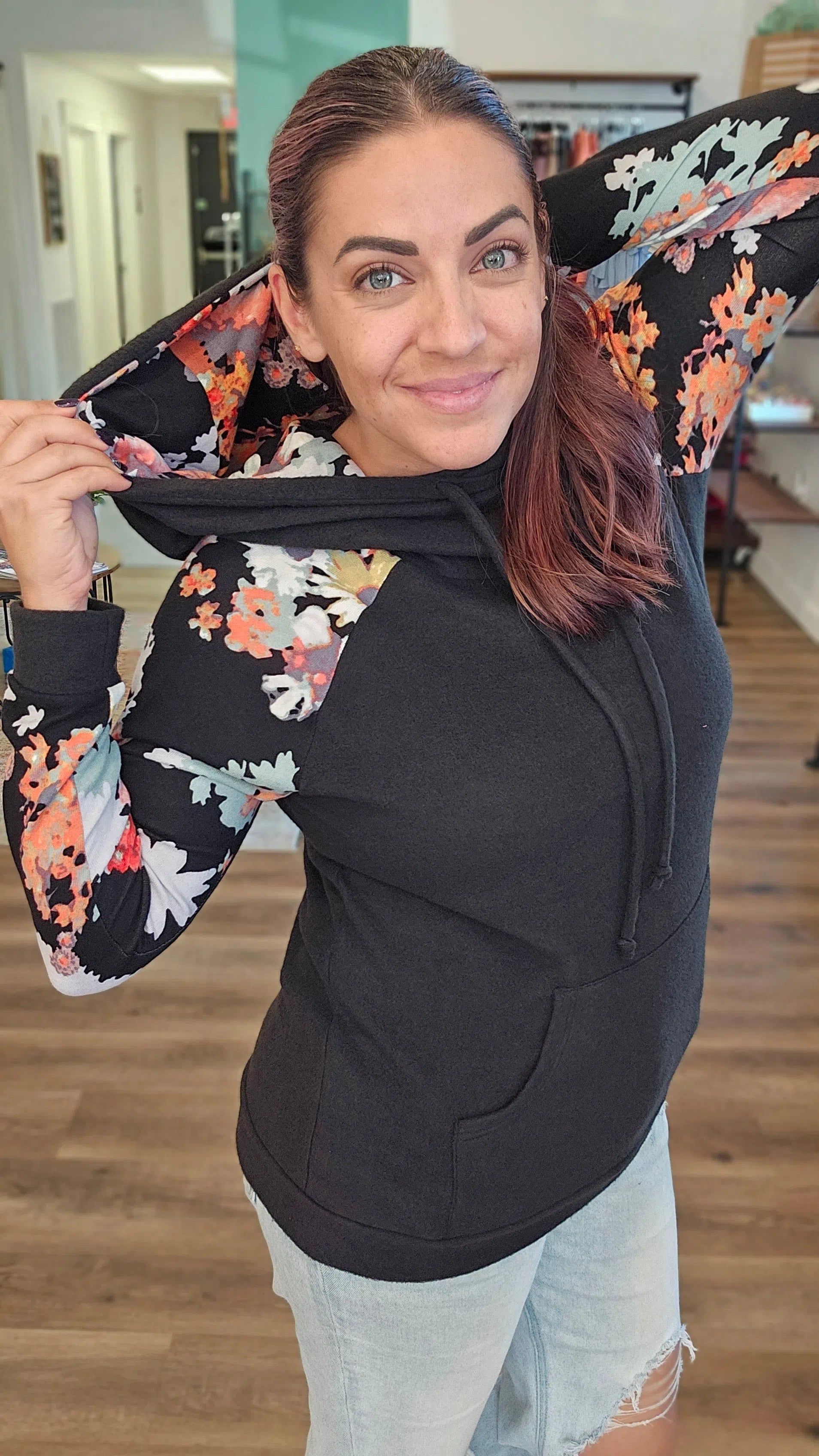 Shop Black and Floral Sleeve Hoodie-Hoodie at Ruby Joy Boutique, a Women's Clothing Store in Pickerington, Ohio