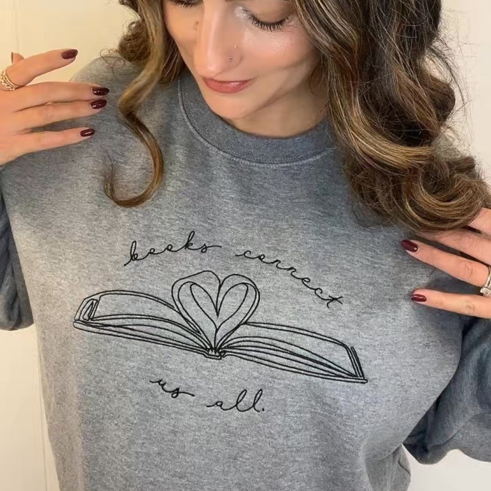 Shop Books Connect Us All Embroidered Crewneck Sweatshirt | Kind Cotton- at Ruby Joy Boutique, a Women's Clothing Store in Pickerington, Ohio