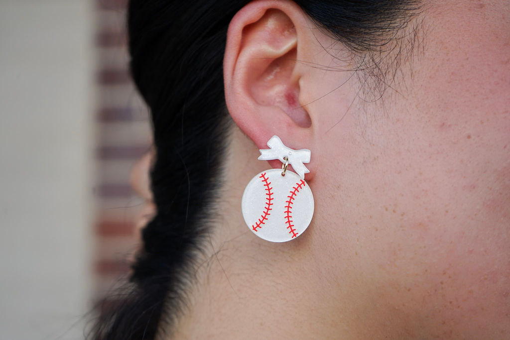 Shop Bow Baseball Earrings- at Ruby Joy Boutique, a Women's Clothing Store in Pickerington, Ohio