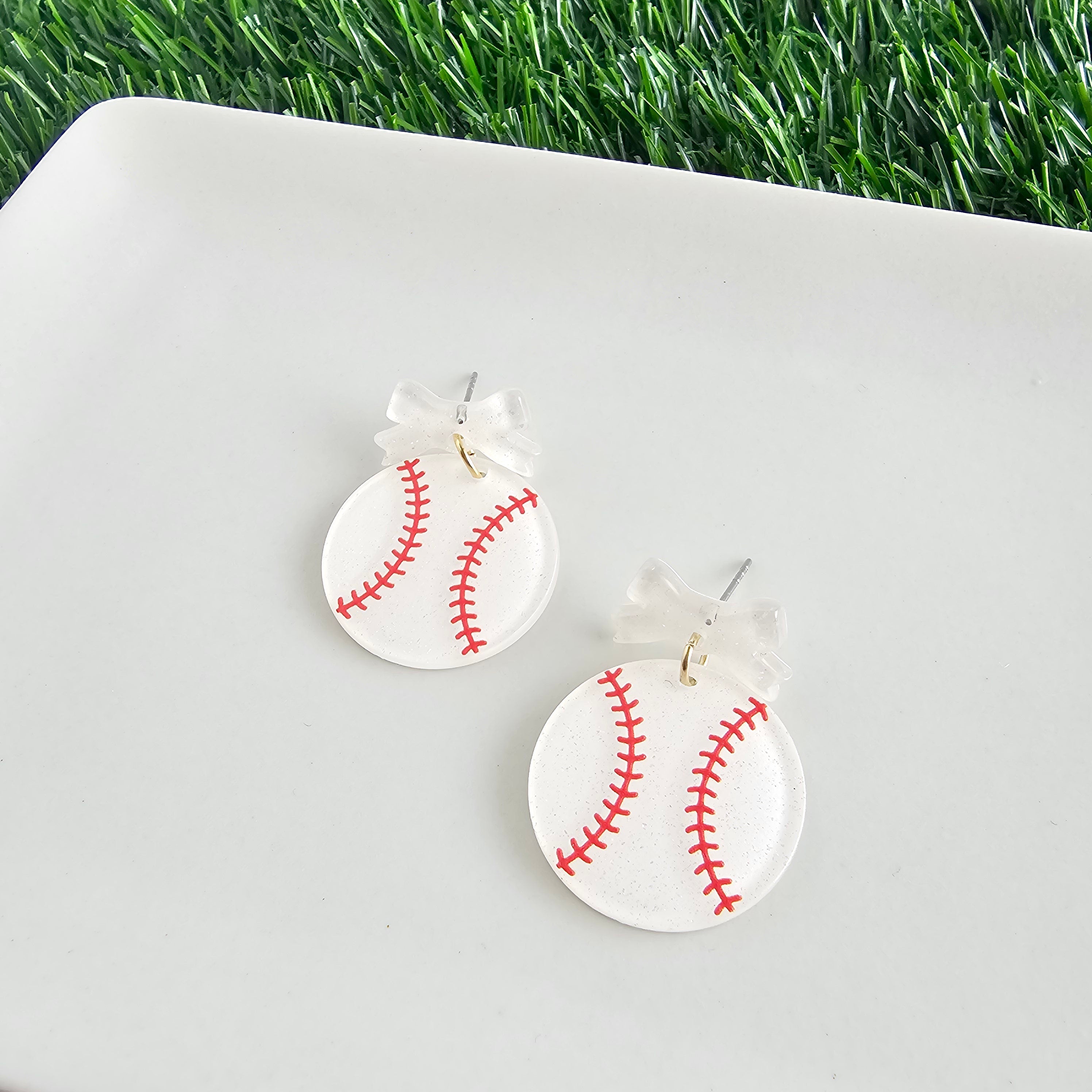 Shop Bow Baseball Earrings- at Ruby Joy Boutique, a Women's Clothing Store in Pickerington, Ohio