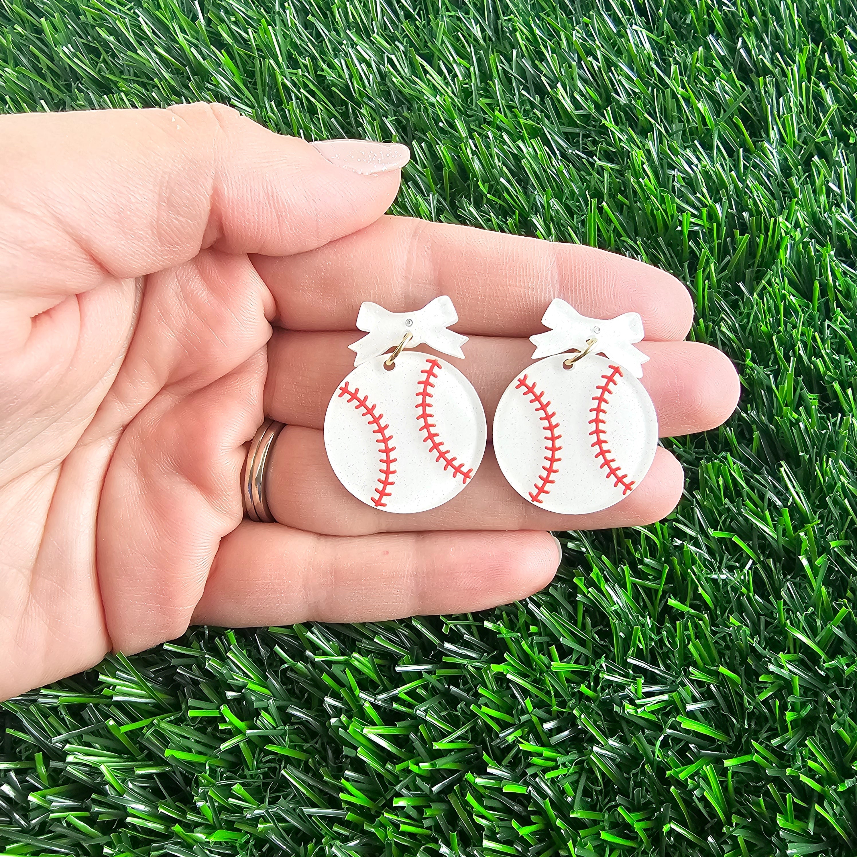 Shop Bow Baseball Earrings- at Ruby Joy Boutique, a Women's Clothing Store in Pickerington, Ohio