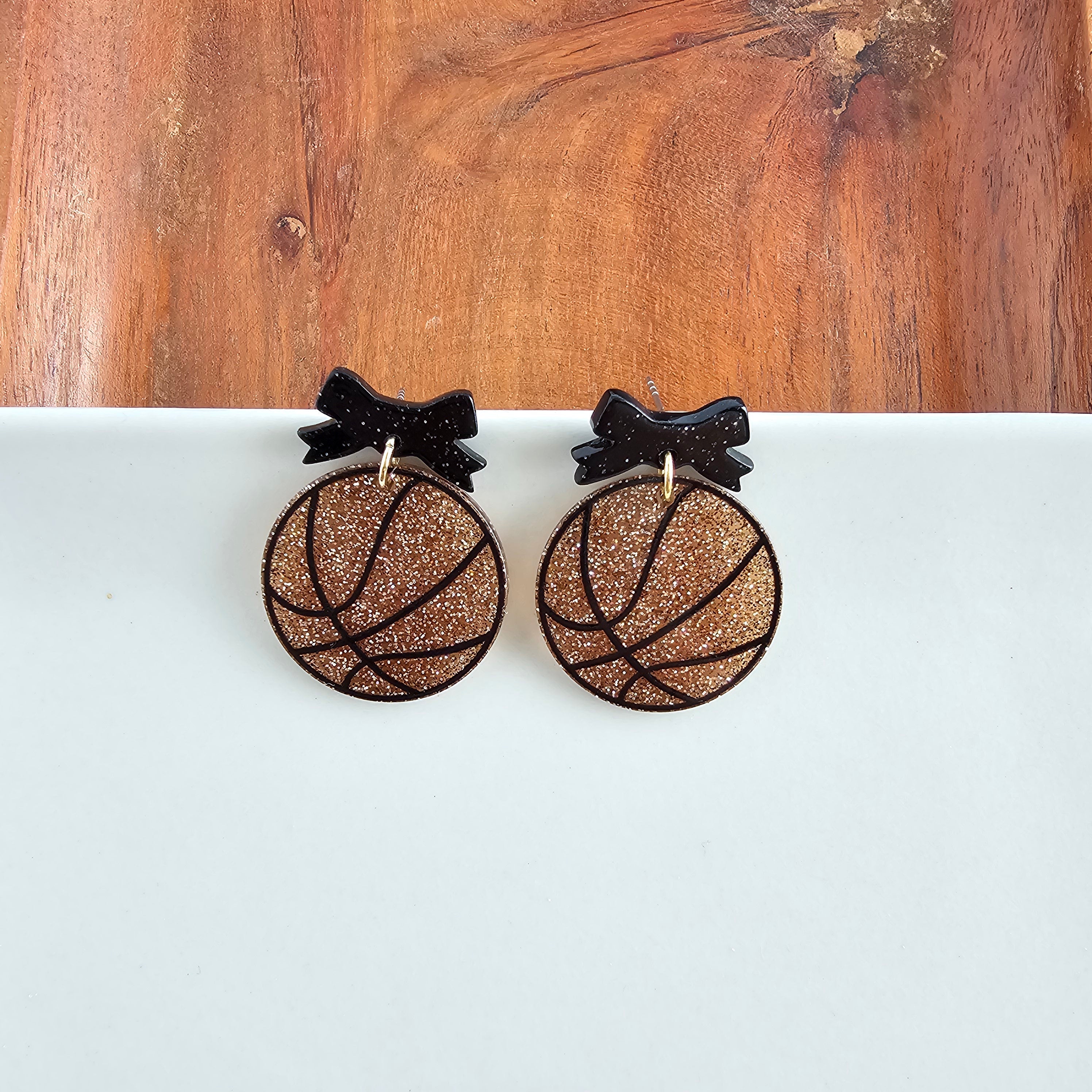 Shop Bow Basketball Earrings- at Ruby Joy Boutique, a Women's Clothing Store in Pickerington, Ohio