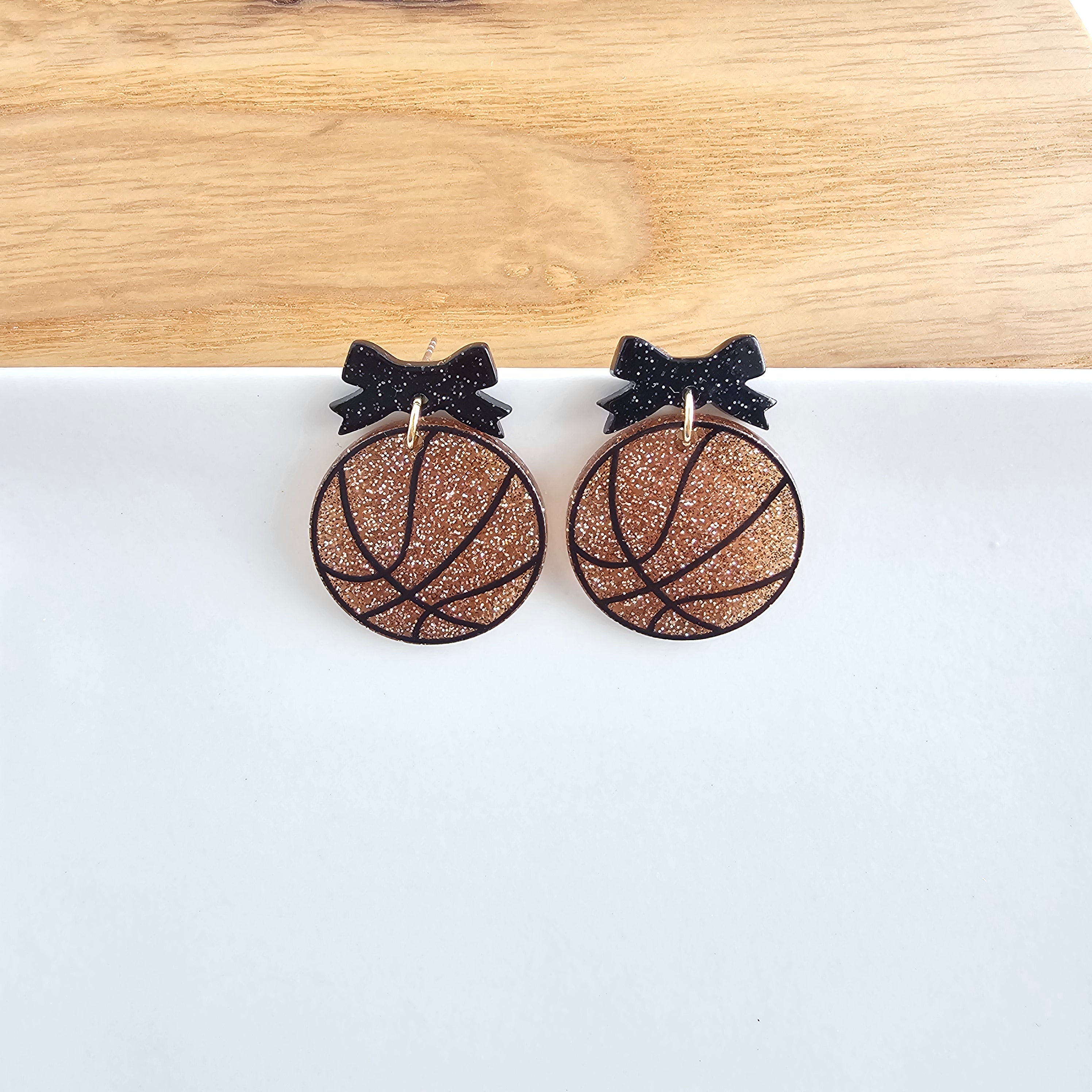 Shop Bow Basketball Earrings- at Ruby Joy Boutique, a Women's Clothing Store in Pickerington, Ohio