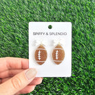 Shop Bow Football Earrings- at Ruby Joy Boutique, a Women's Clothing Store in Pickerington, Ohio