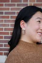 Shop Bow Football Earrings- at Ruby Joy Boutique, a Women's Clothing Store in Pickerington, Ohio