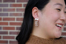 Shop Bow Football Earrings- at Ruby Joy Boutique, a Women's Clothing Store in Pickerington, Ohio