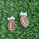 Shop Bow Football Earrings- at Ruby Joy Boutique, a Women's Clothing Store in Pickerington, Ohio
