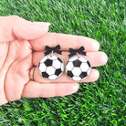 Shop Bow Soccer Ball Earrings- at Ruby Joy Boutique, a Women's Clothing Store in Pickerington, Ohio