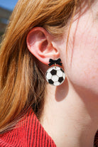 Shop Bow Soccer Ball Earrings- at Ruby Joy Boutique, a Women's Clothing Store in Pickerington, Ohio