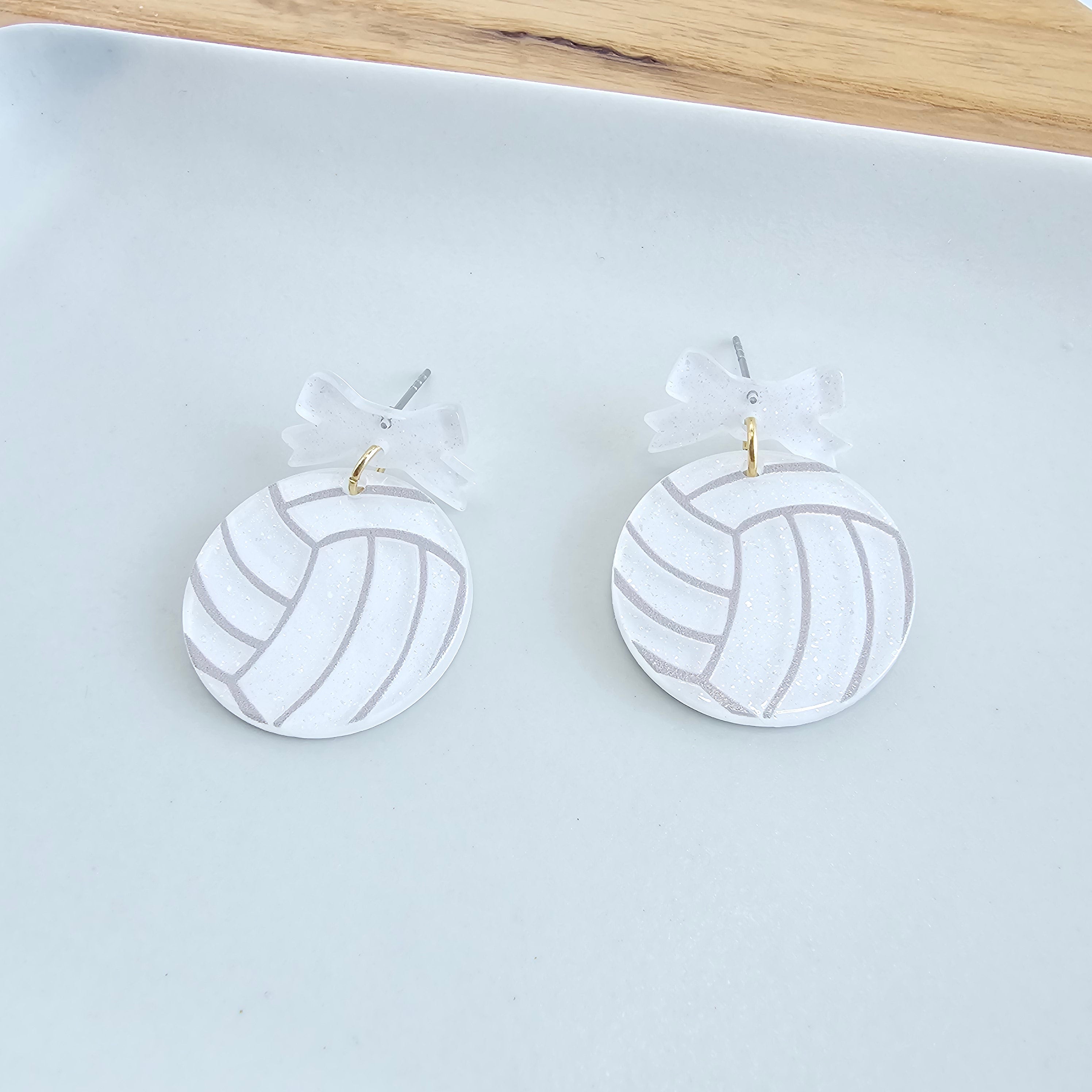 Shop Bow Volleyball Earrings- at Ruby Joy Boutique, a Women's Clothing Store in Pickerington, Ohio