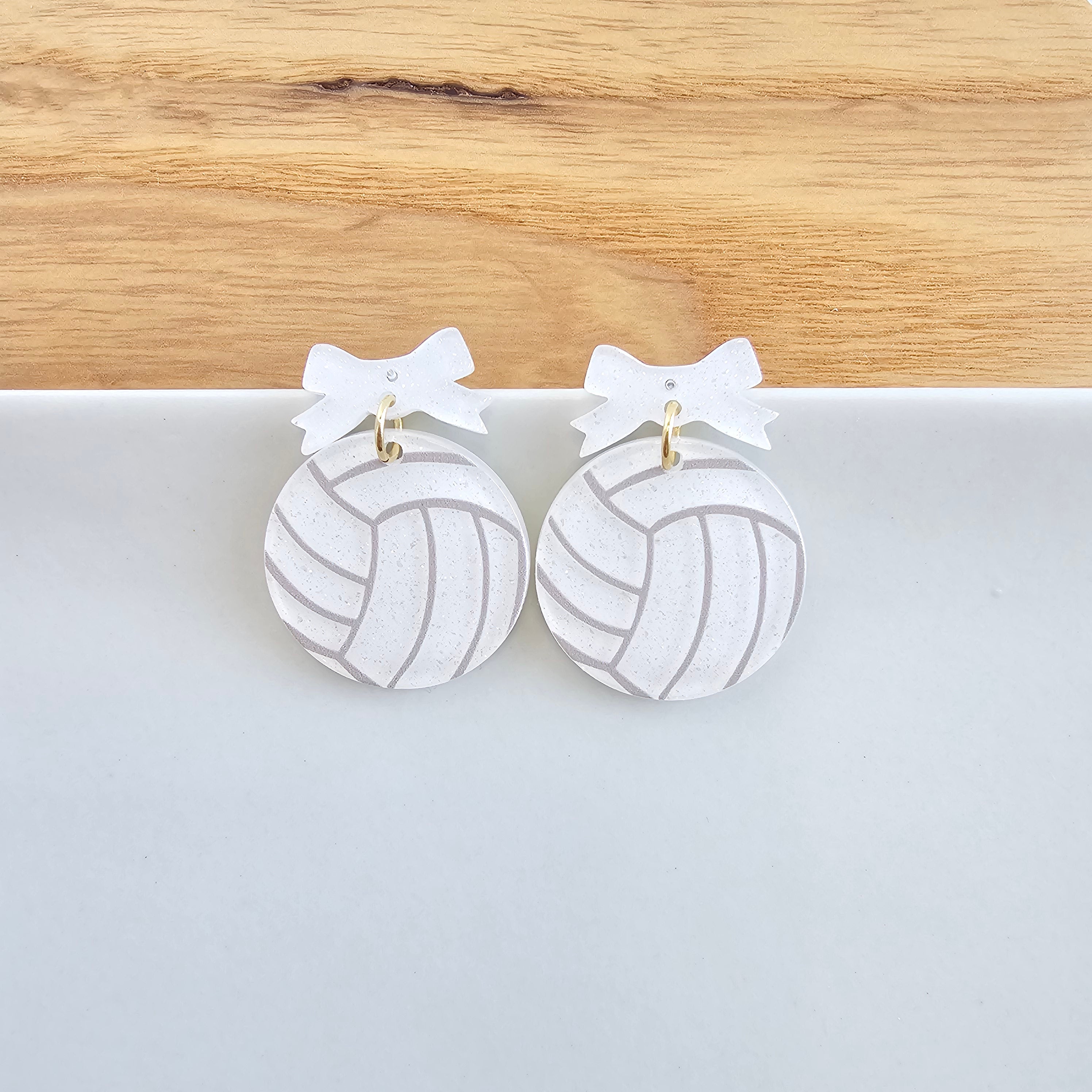 Shop Bow Volleyball Earrings- at Ruby Joy Boutique, a Women's Clothing Store in Pickerington, Ohio