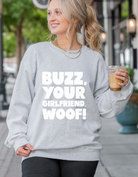 Shop Buzz, Your Girlfriend Woof! Graphic Top | Home Alone Christmas- at Ruby Joy Boutique, a Women's Clothing Store in Pickerington, Ohio