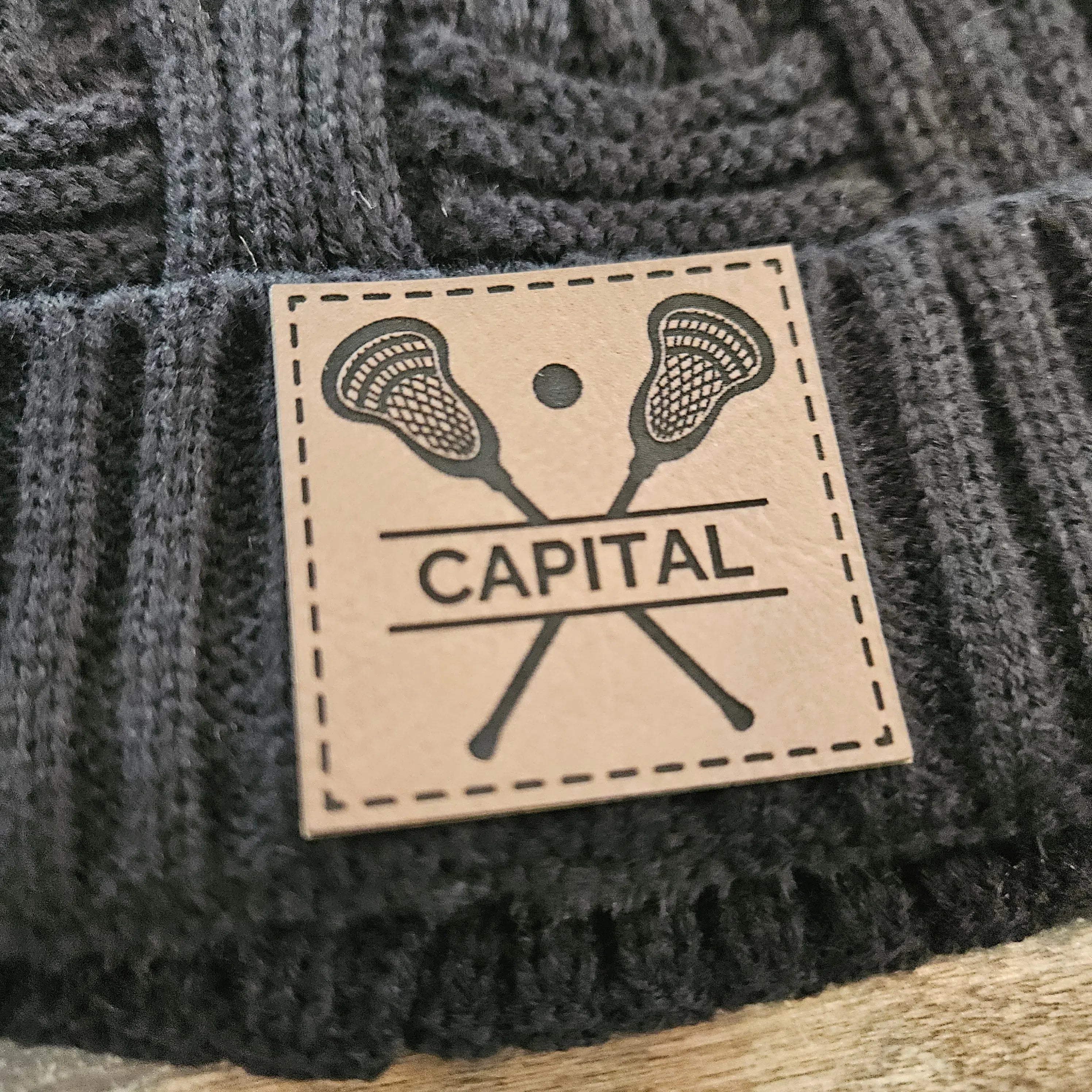 Shop Custom Lacrosse Patch Beanie- at Ruby Joy Boutique, a Women's Clothing Store in Pickerington, Ohio