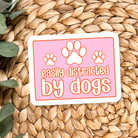 Shop Distracted by Dogs Waterproof Vinyl Sticker- at Ruby Joy Boutique, a Women's Clothing Store in Pickerington, Ohio