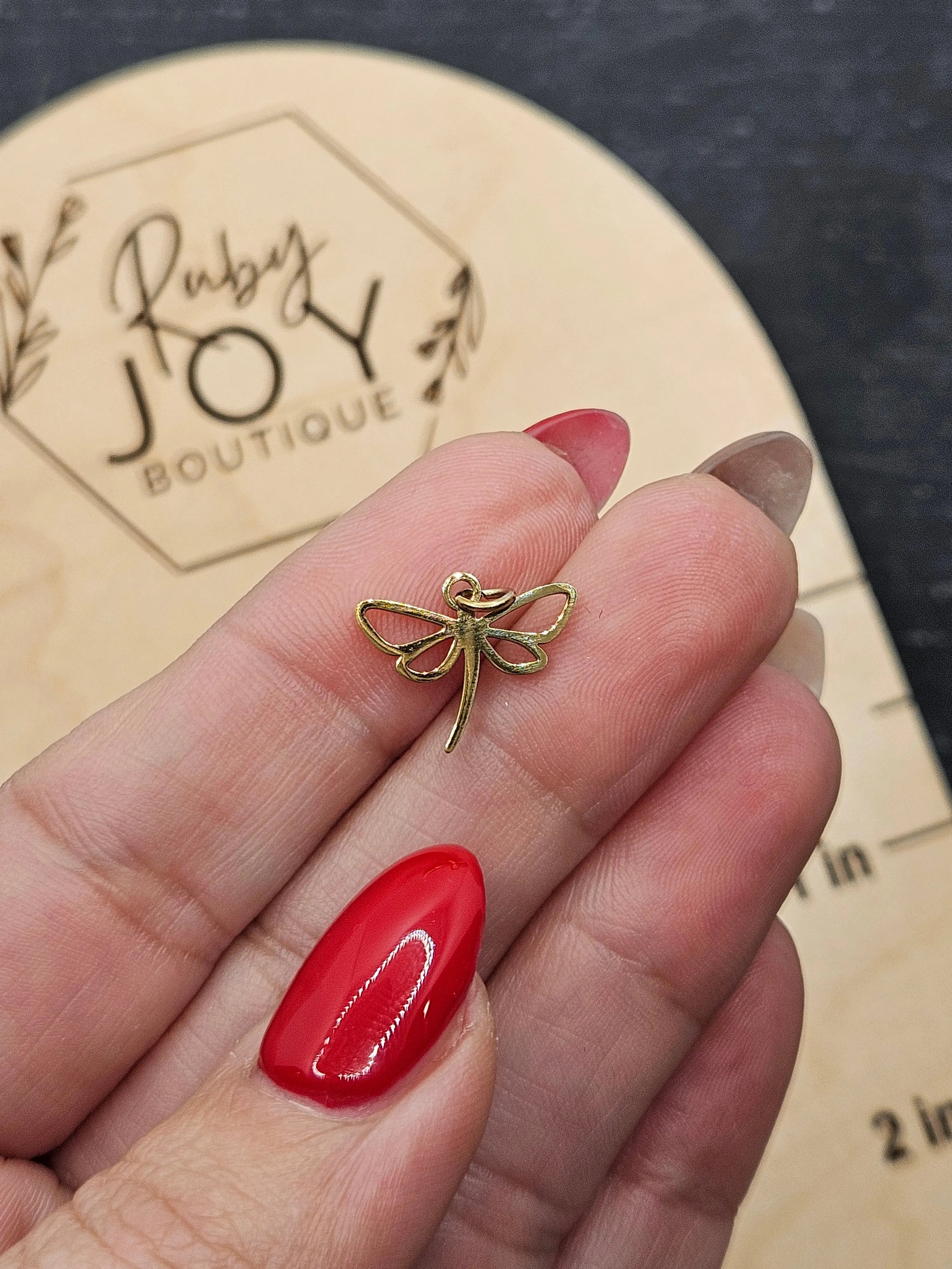 Shop Dragonfly Outline Charm- at Ruby Joy Boutique, a Women's Clothing Store in Pickerington, Ohio
