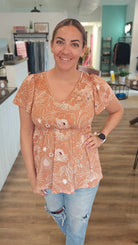 Shop Emery Ruffle Top - Cocoa Floral-Short Sleeve Top at Ruby Joy Boutique, a Women's Clothing Store in Pickerington, Ohio