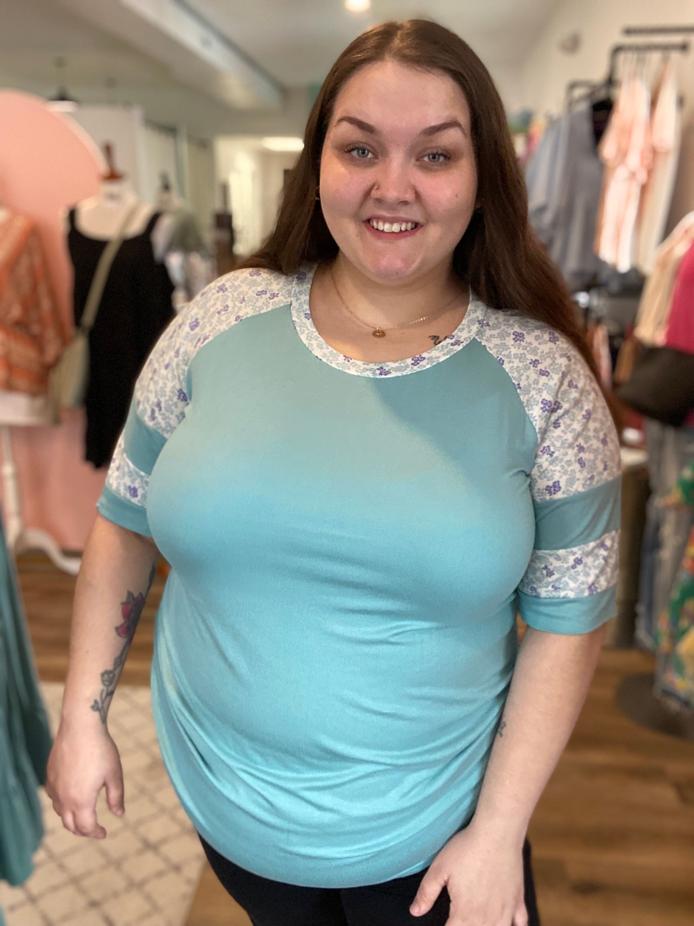 Shop Floral Baseball Sleeve Top-Short Sleeve Top at Ruby Joy Boutique, a Women's Clothing Store in Pickerington, Ohio