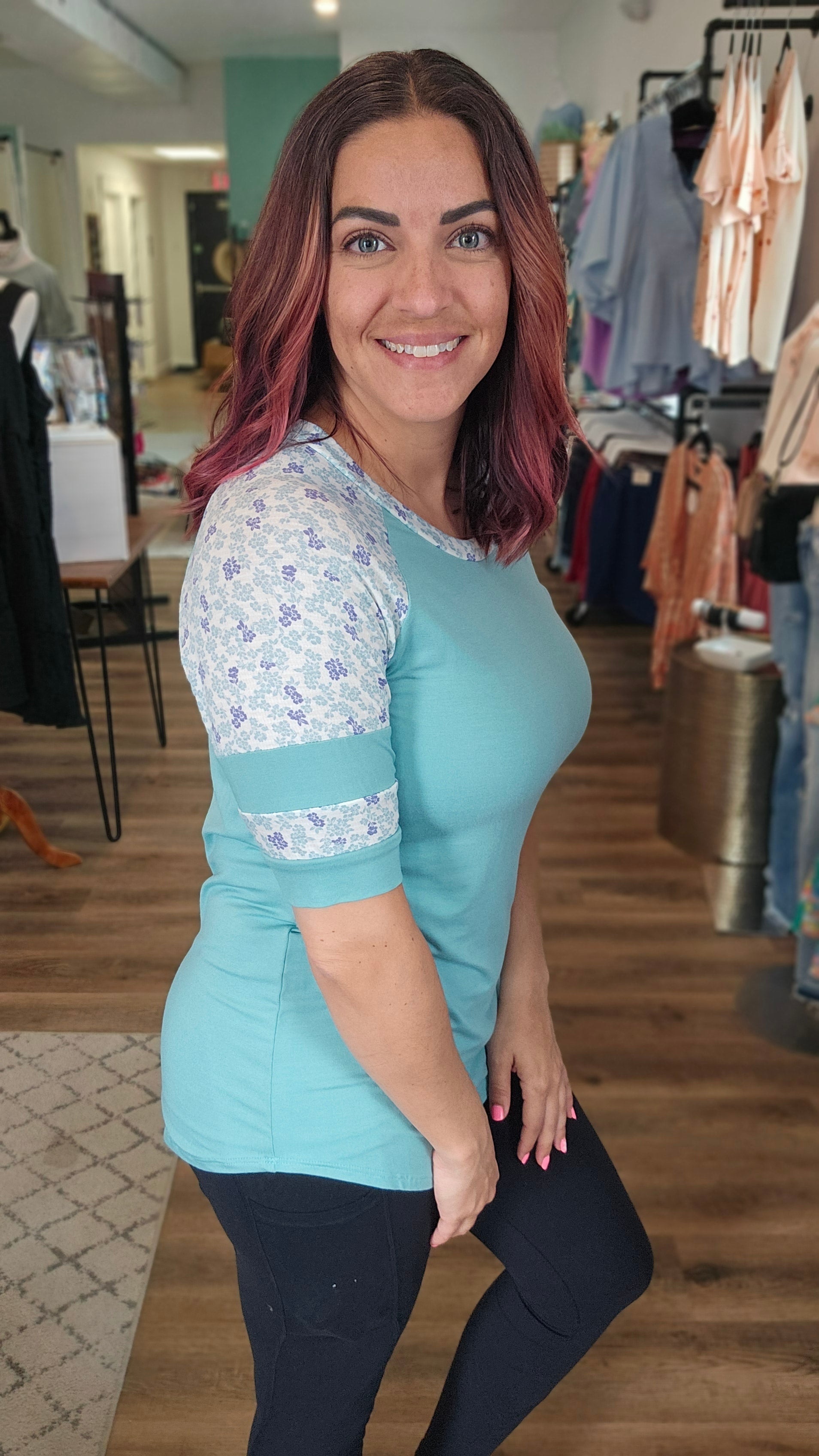 Shop Floral Baseball Sleeve Top-Short Sleeve Top at Ruby Joy Boutique, a Women's Clothing Store in Pickerington, Ohio