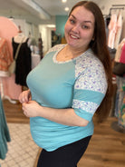 Shop Floral Baseball Sleeve Top-Shirts & Tops at Ruby Joy Boutique, a Women's Clothing Store in Pickerington, Ohio