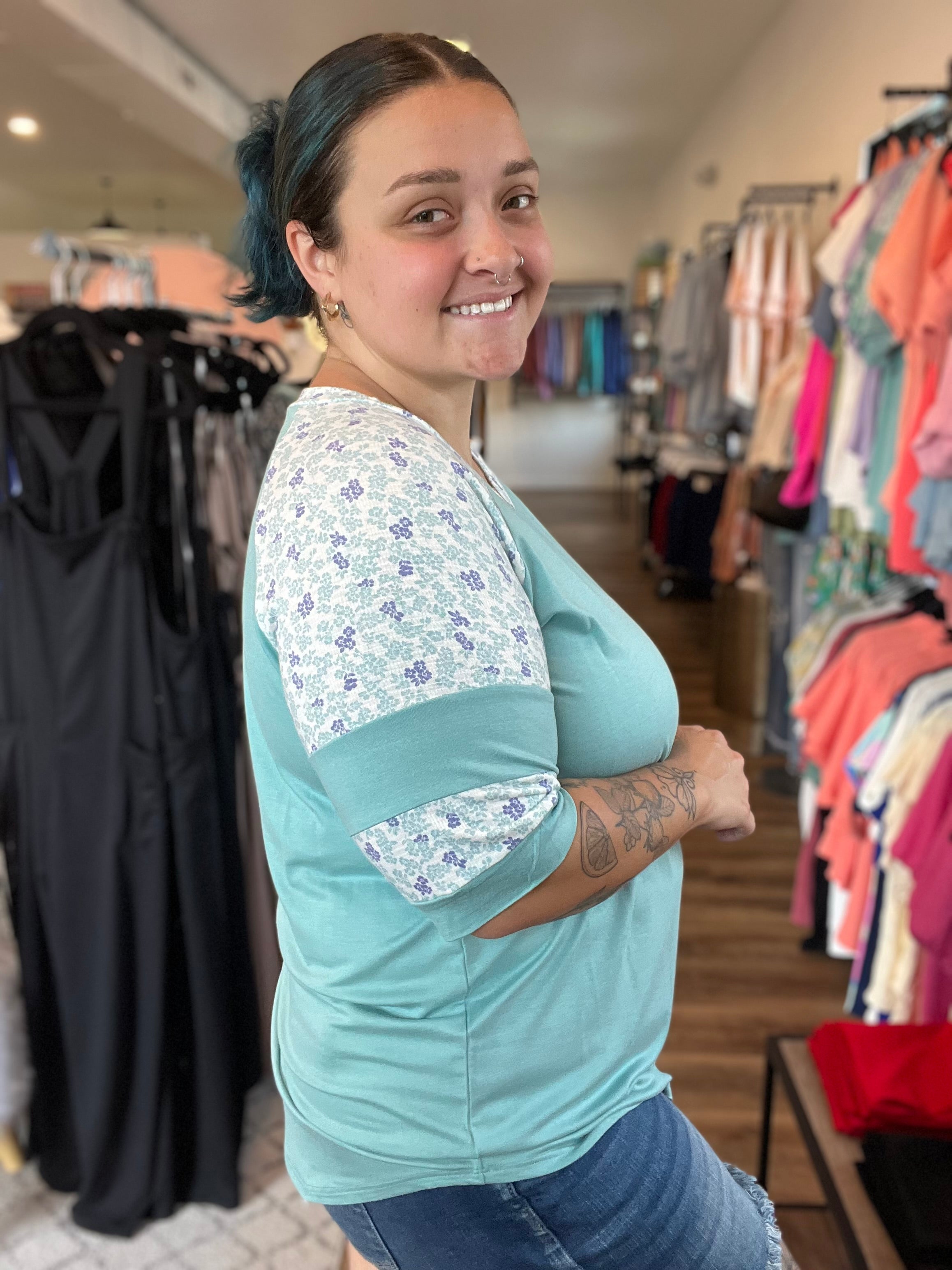 Shop Floral Baseball Sleeve Top-Short Sleeve Top at Ruby Joy Boutique, a Women's Clothing Store in Pickerington, Ohio