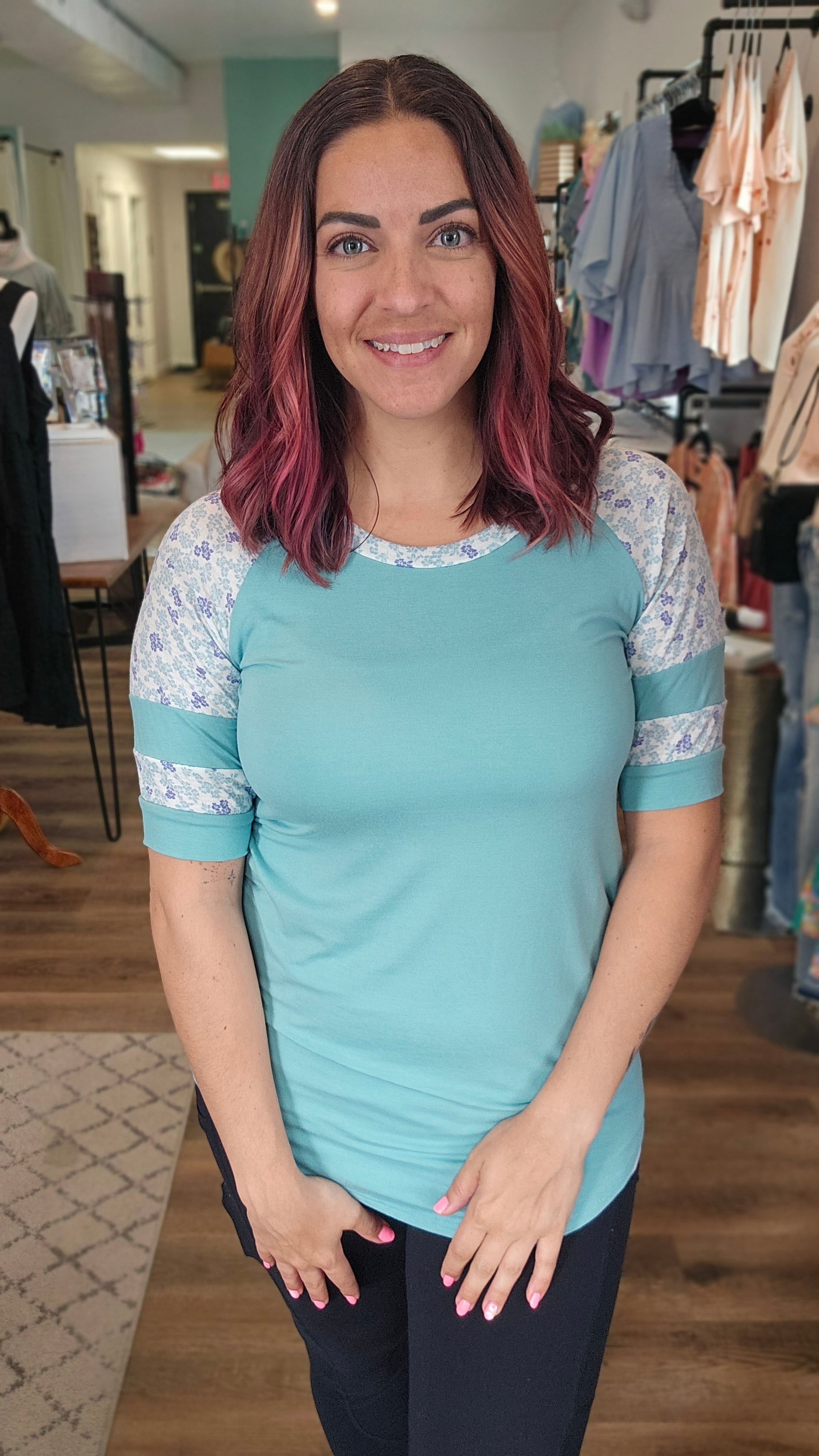 Shop Floral Baseball Sleeve Top-Short Sleeve Top at Ruby Joy Boutique, a Women's Clothing Store in Pickerington, Ohio