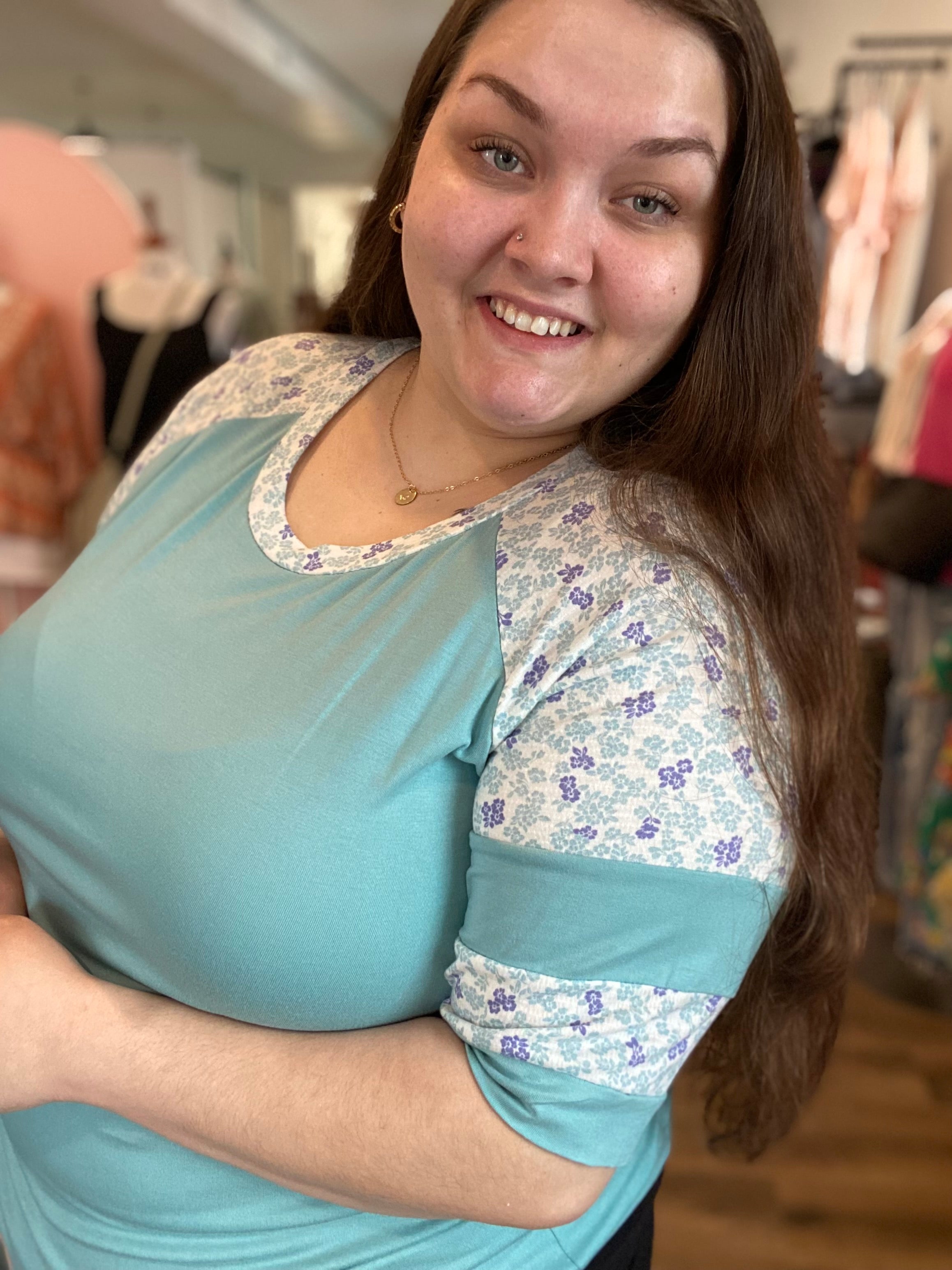 Shop Floral Baseball Sleeve Top-Short Sleeve Top at Ruby Joy Boutique, a Women's Clothing Store in Pickerington, Ohio