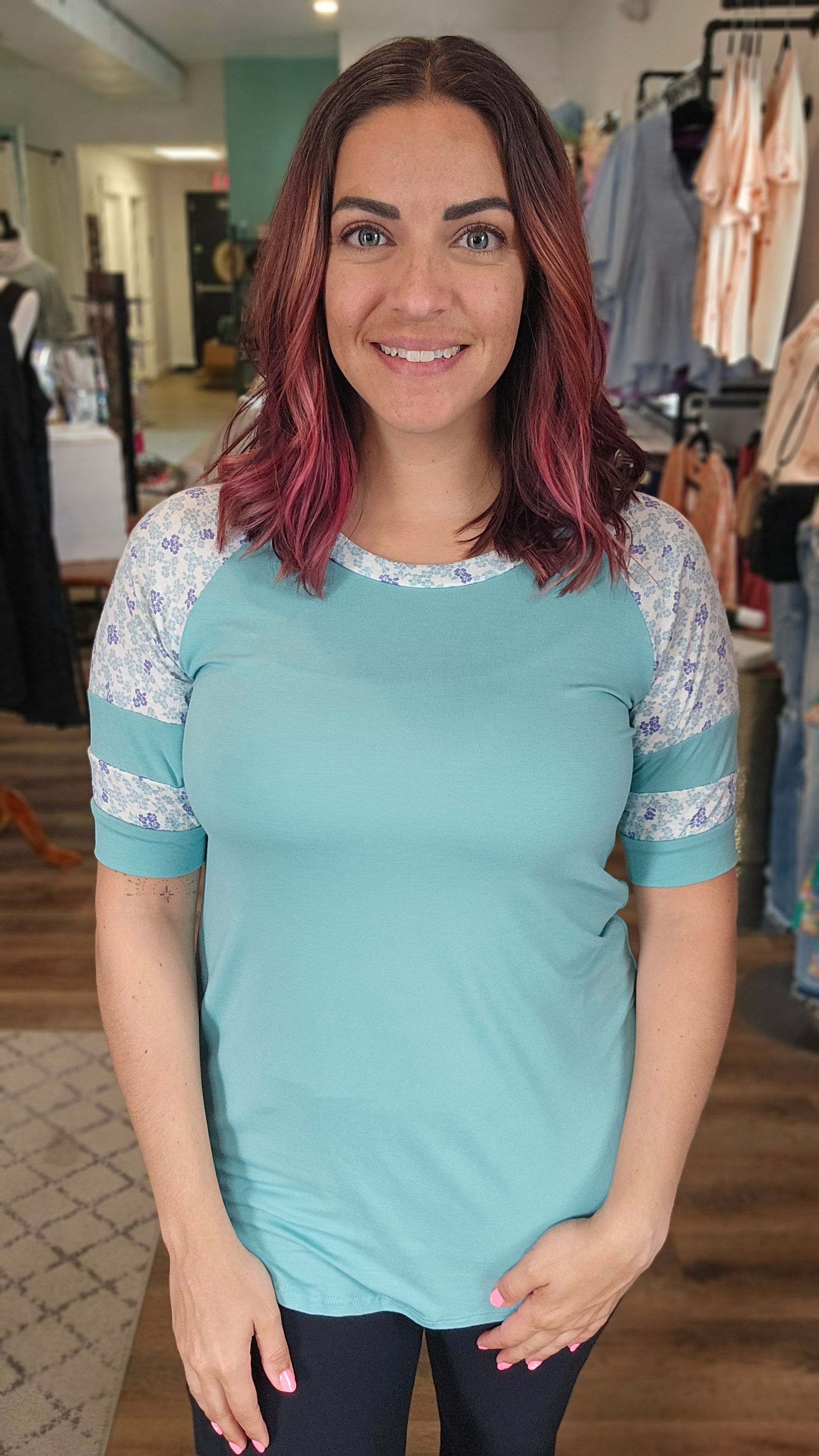 Shop Floral Baseball Sleeve Top-Short Sleeve Top at Ruby Joy Boutique, a Women's Clothing Store in Pickerington, Ohio