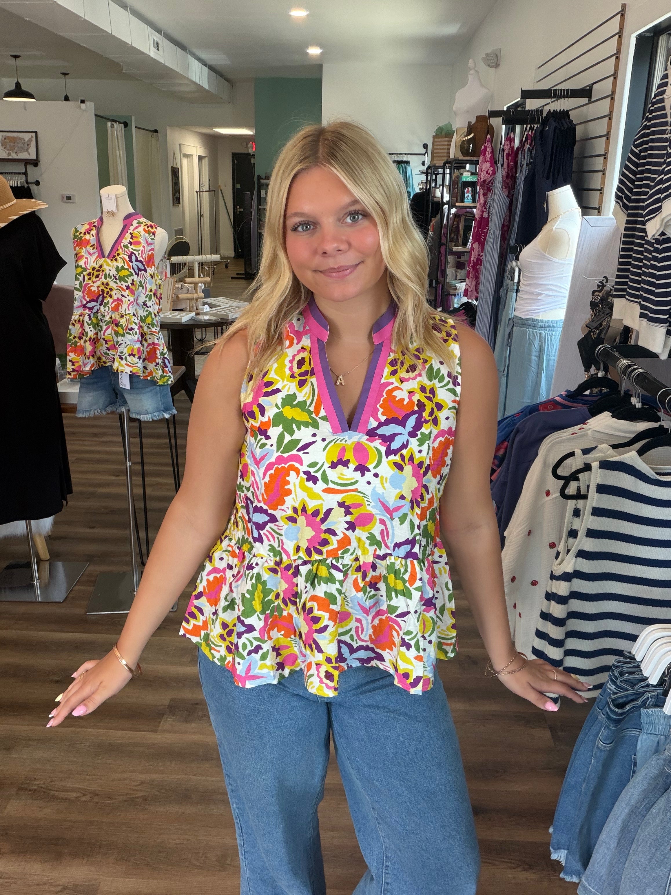 Shop Floral Print Contrast Trim Sleeveless Peplum Blouse- at Ruby Joy Boutique, a Women's Clothing Store in Pickerington, Ohio