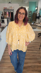 Shop Floral Print Peasant Top with Puff Sleeves and Tie Neck- at Ruby Joy Boutique, a Women's Clothing Store in Pickerington, Ohio