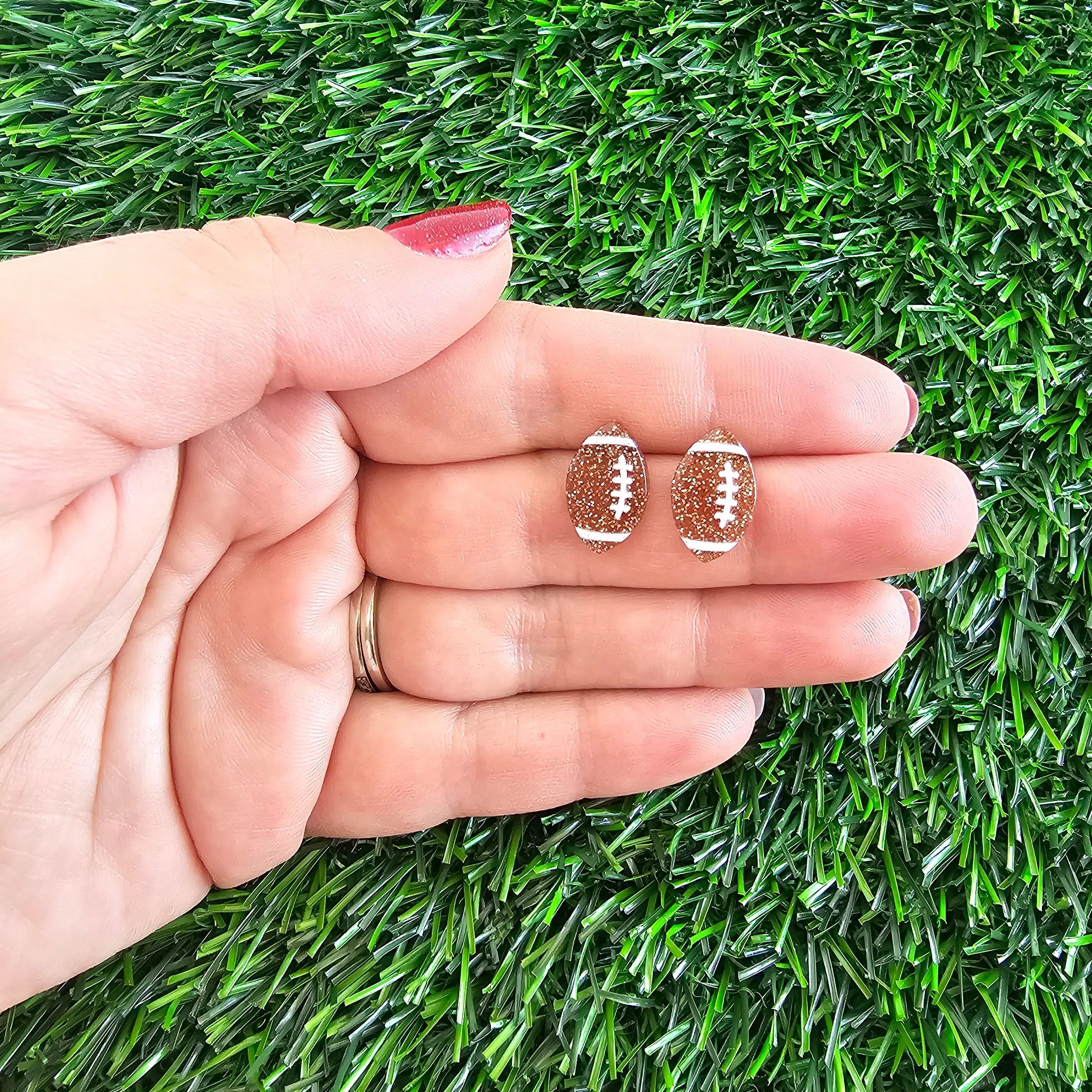 Shop Glitter Football Studs- at Ruby Joy Boutique, a Women's Clothing Store in Pickerington, Ohio